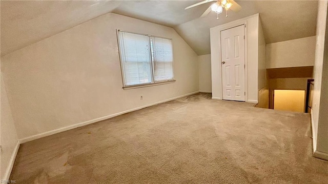 bonus room featuring baseboards, carpet, a ceiling fan, and vaulted ceiling