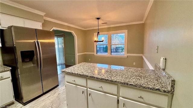 kitchen featuring crown molding, arched walkways, stainless steel refrigerator with ice dispenser, and marble finish floor