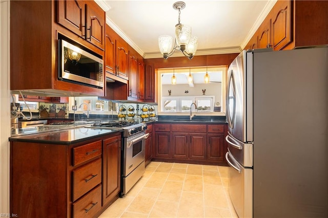 kitchen with a sink, dark countertops, ornamental molding, and stainless steel appliances