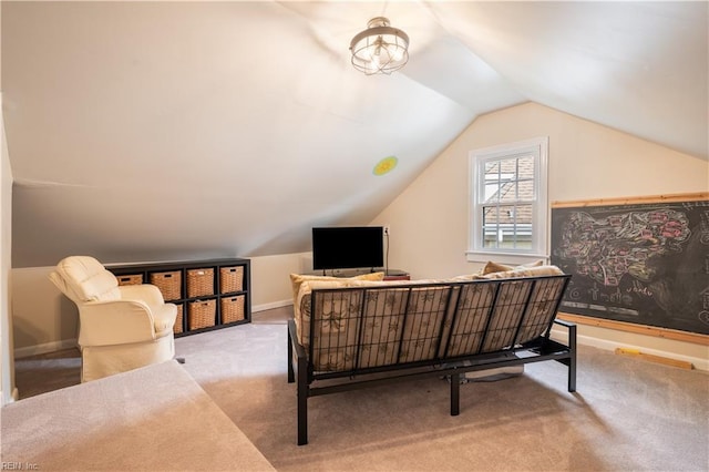 interior space featuring baseboards and vaulted ceiling