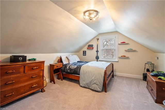 bedroom featuring baseboards, light colored carpet, and lofted ceiling