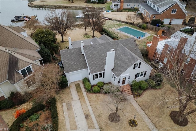 birds eye view of property with a water view