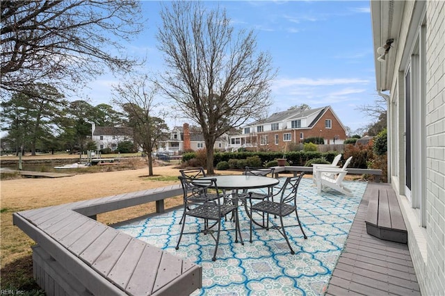 wooden deck with a patio and outdoor dining area