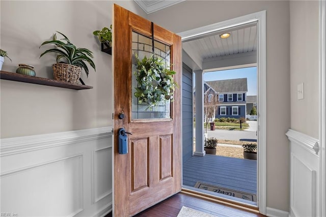 entryway with wood finished floors