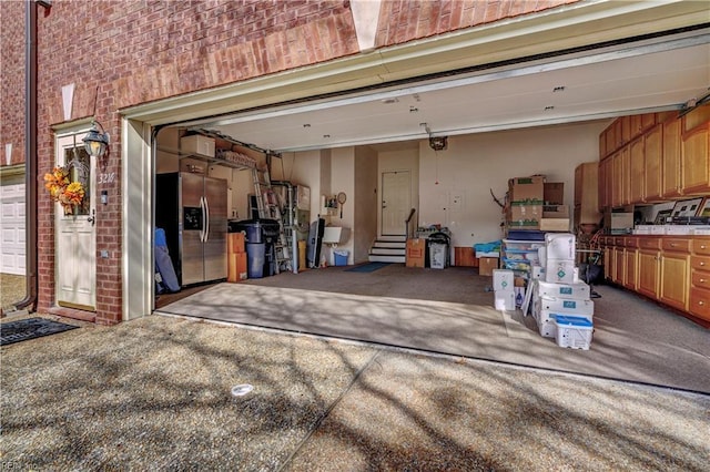 garage with stainless steel fridge