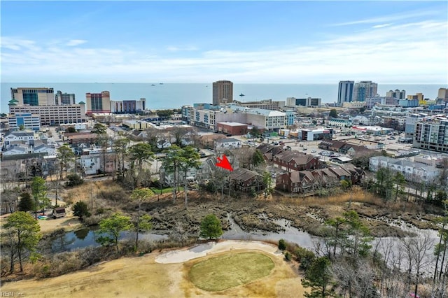 drone / aerial view featuring a view of city and a water view