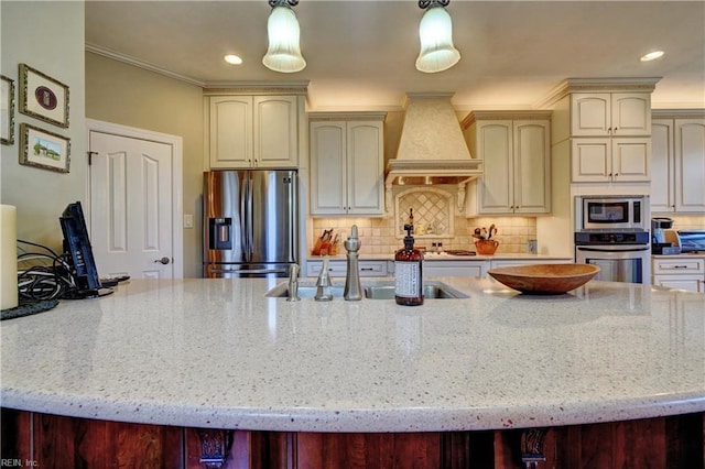 kitchen featuring premium range hood, stainless steel appliances, light stone countertops, and tasteful backsplash