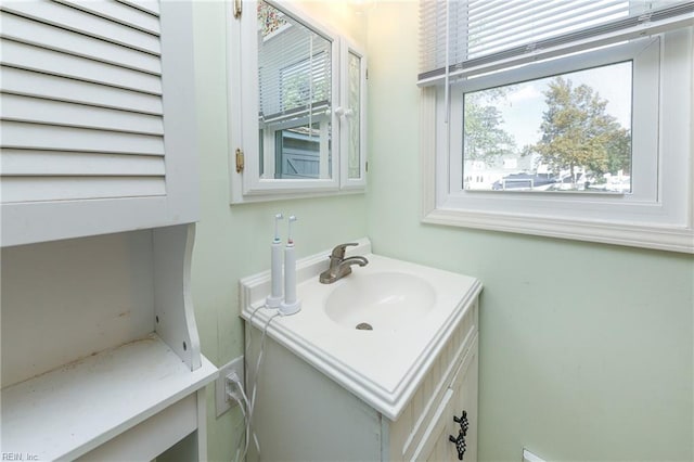 bathroom with a wealth of natural light and vanity