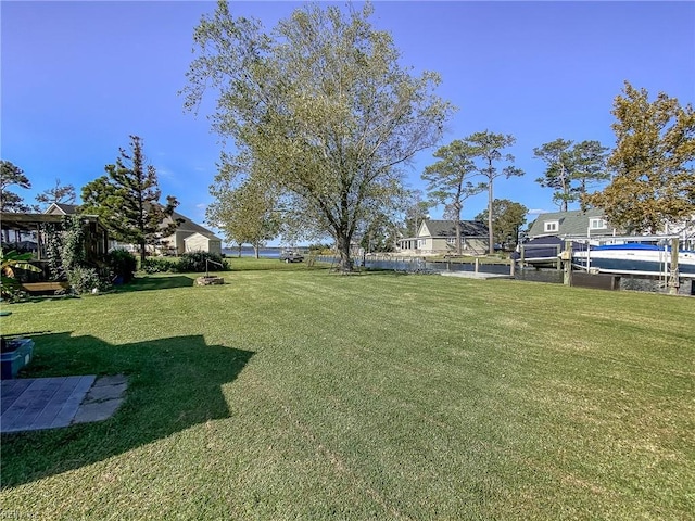 view of yard featuring a dock