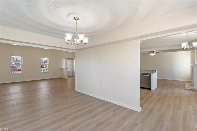 unfurnished room featuring ceiling fan with notable chandelier, light wood-style floors, baseboards, and a textured ceiling