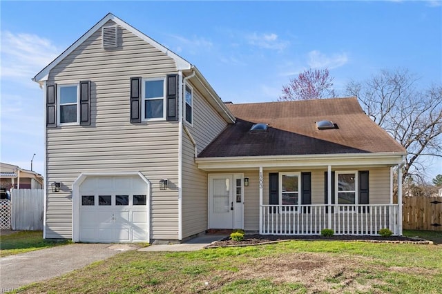 traditional-style house with fence, aphalt driveway, a porch, a front yard, and an attached garage