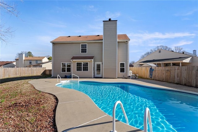 view of pool featuring a patio area, a fenced backyard, and a fenced in pool