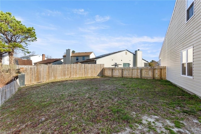 view of yard featuring a fenced backyard