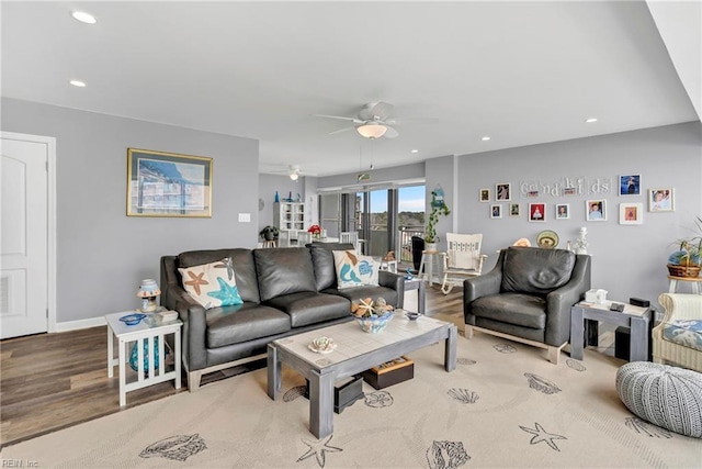 living room featuring wood finished floors, recessed lighting, baseboards, and ceiling fan