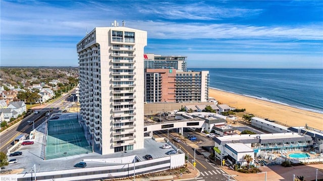 birds eye view of property with a city view, a view of the beach, and a water view