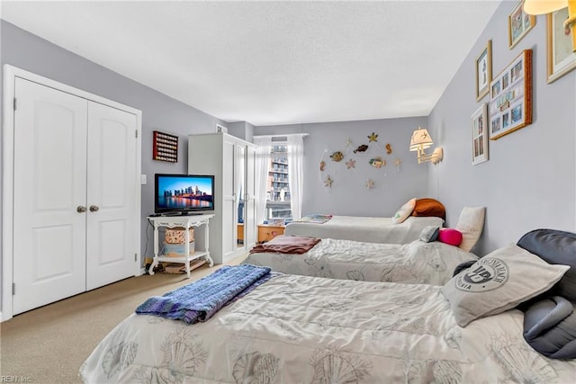 carpeted bedroom with a closet