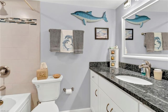 bathroom with shower / bath combination, toilet, and vanity