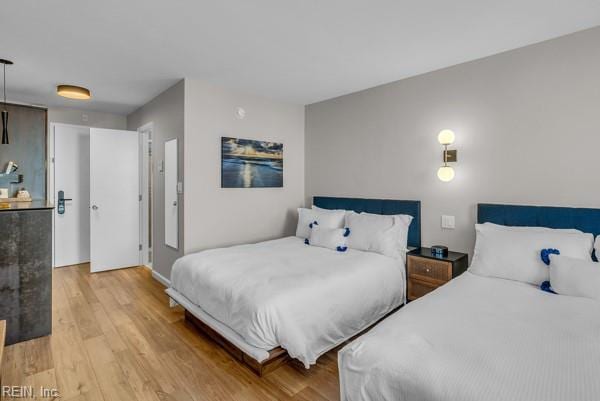 bedroom with light wood finished floors