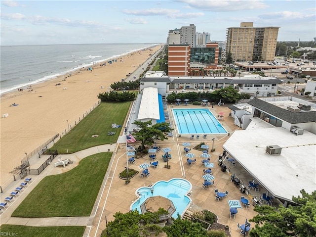 aerial view featuring a view of the beach and a water view