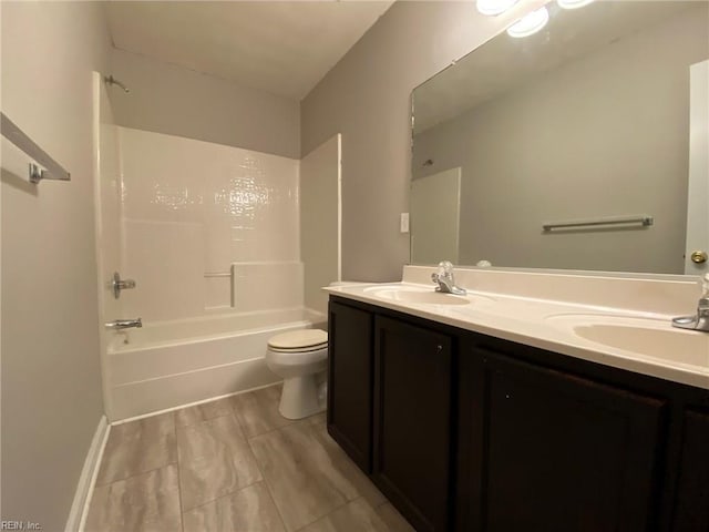 bathroom with a sink, toilet,  shower combination, and double vanity