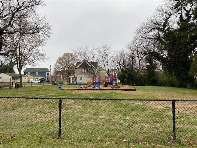 view of yard with playground community and fence