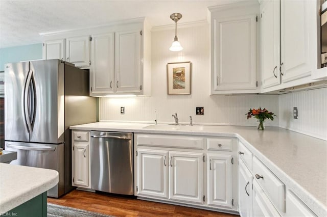 kitchen with a sink, light countertops, white cabinetry, and stainless steel appliances