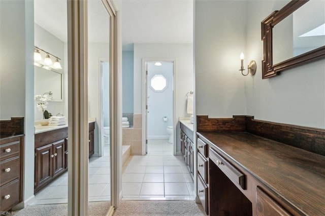 full bath with tile patterned floors, toilet, and vanity