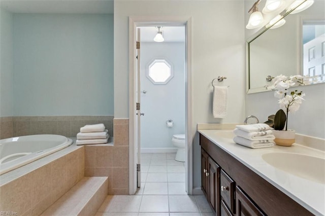 full bathroom with tile patterned floors, toilet, a sink, double vanity, and a bath