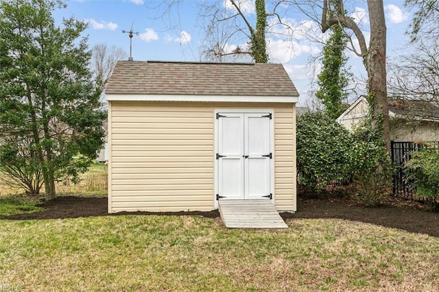 view of shed with fence