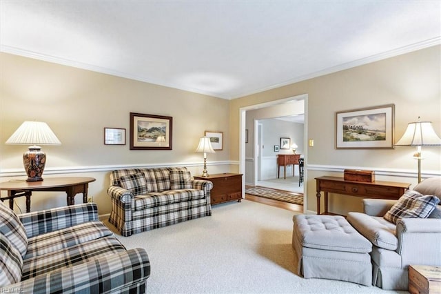 living area featuring carpet floors and ornamental molding