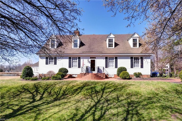 cape cod house with a front lawn