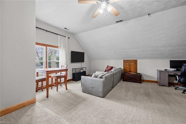 carpeted living room featuring visible vents, baseboards, ceiling fan, and vaulted ceiling