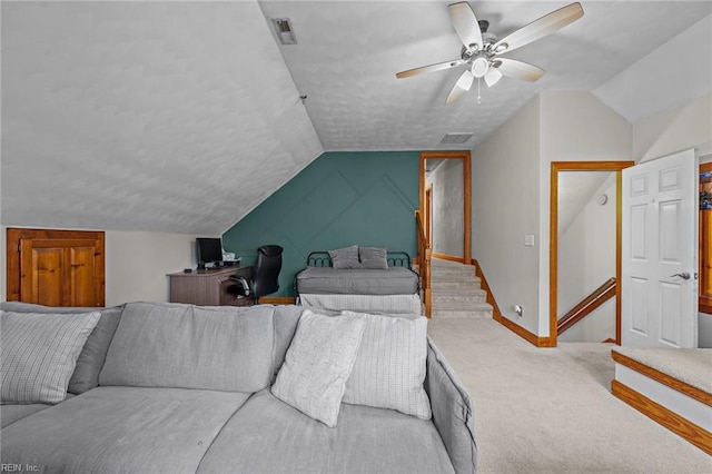 bedroom with a ceiling fan, lofted ceiling, carpet, and visible vents