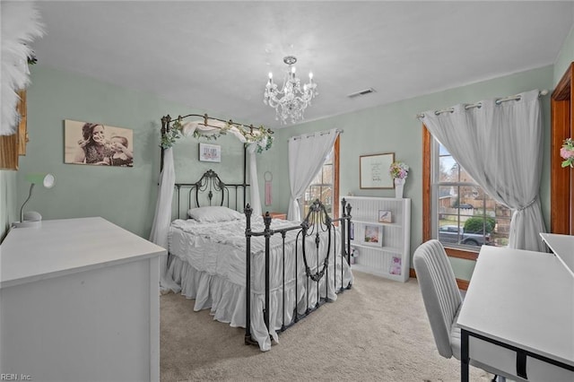 bedroom featuring an inviting chandelier, visible vents, and light carpet