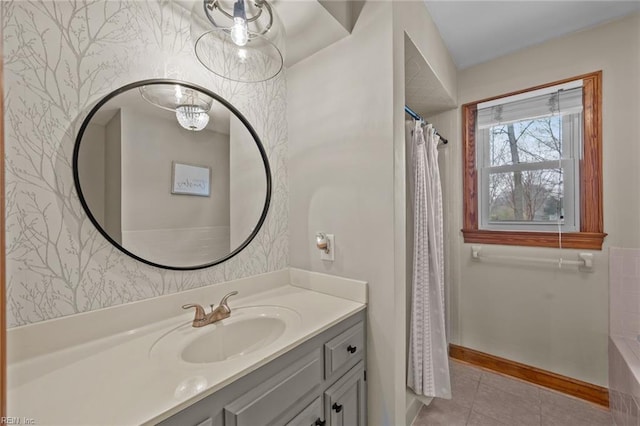 bathroom featuring curtained shower, wallpapered walls, baseboards, tile patterned floors, and vanity