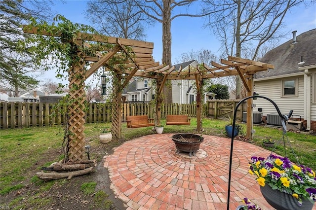 view of patio / terrace with fence, a pergola, central AC, and an outdoor fire pit