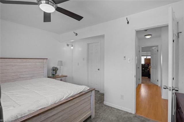 bedroom with baseboards and ceiling fan