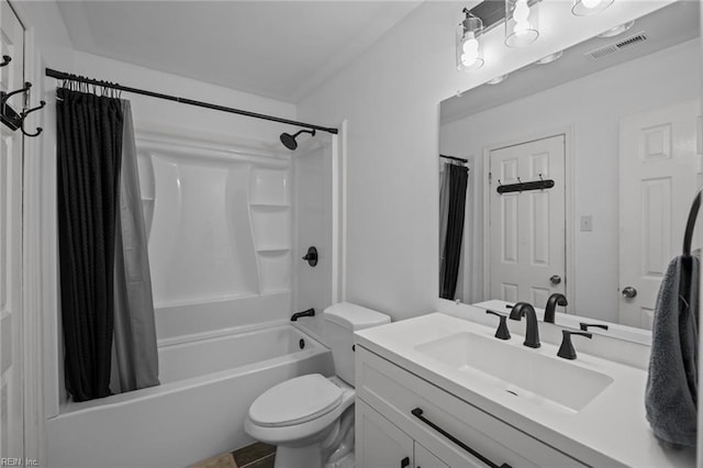 bathroom with vanity, toilet, shower / bath combo, and visible vents