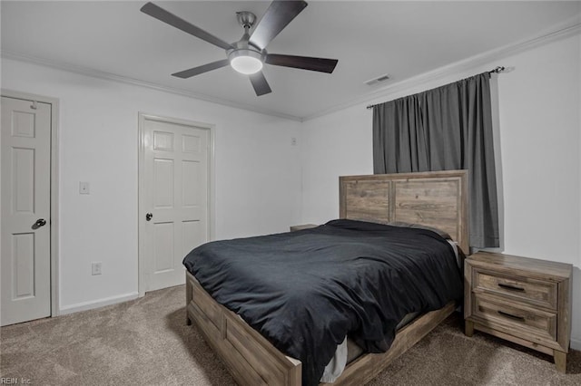 bedroom featuring visible vents, ornamental molding, a ceiling fan, carpet, and baseboards