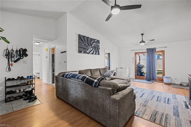 living area with high vaulted ceiling, wood finished floors, and ceiling fan