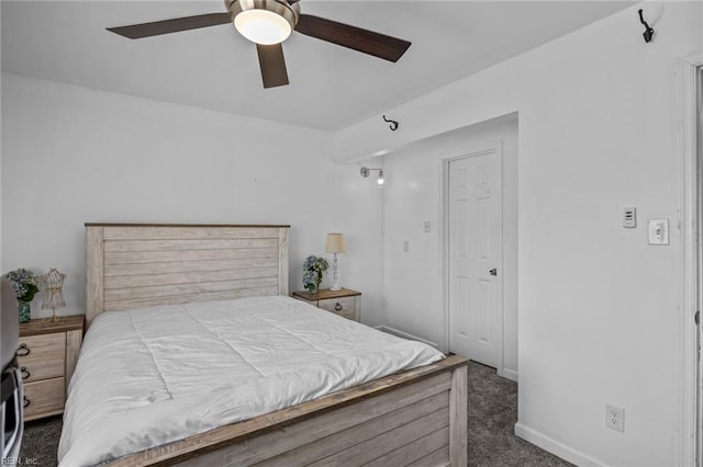 carpeted bedroom with baseboards and ceiling fan