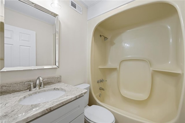 bathroom featuring vanity, toilet, visible vents, and shower / bathtub combination