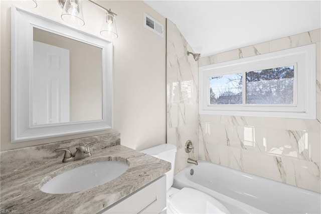 full bath featuring bathing tub / shower combination, visible vents, toilet, and vanity