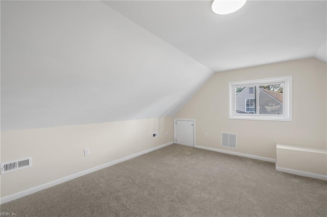 bonus room with visible vents, carpet flooring, lofted ceiling, and baseboards