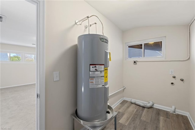 utility room with water heater