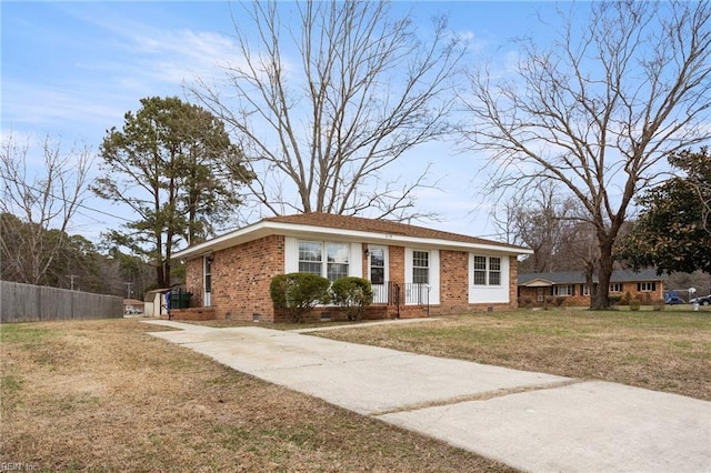 single story home featuring crawl space, a front yard, brick siding, and fence