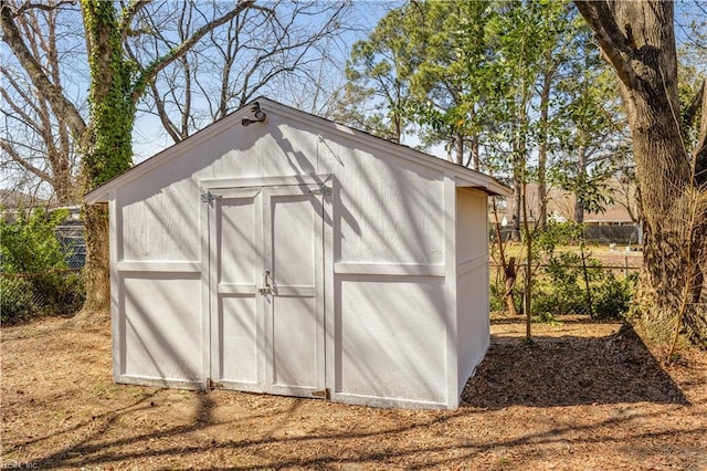 view of shed with fence