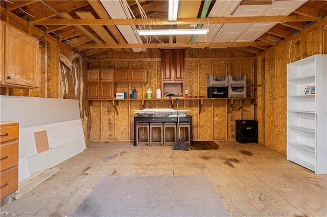 interior space with a kitchen breakfast bar and brown cabinetry