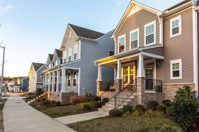 view of front facade featuring a residential view and covered porch