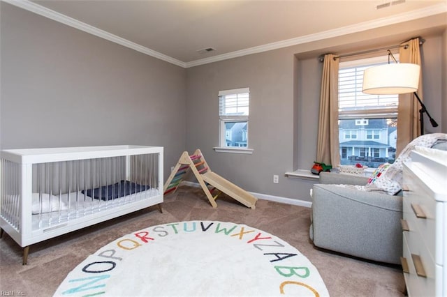 carpeted bedroom with visible vents, baseboards, and crown molding